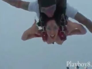 Three lusty babes with nice big tits enjoy trying out skydiving